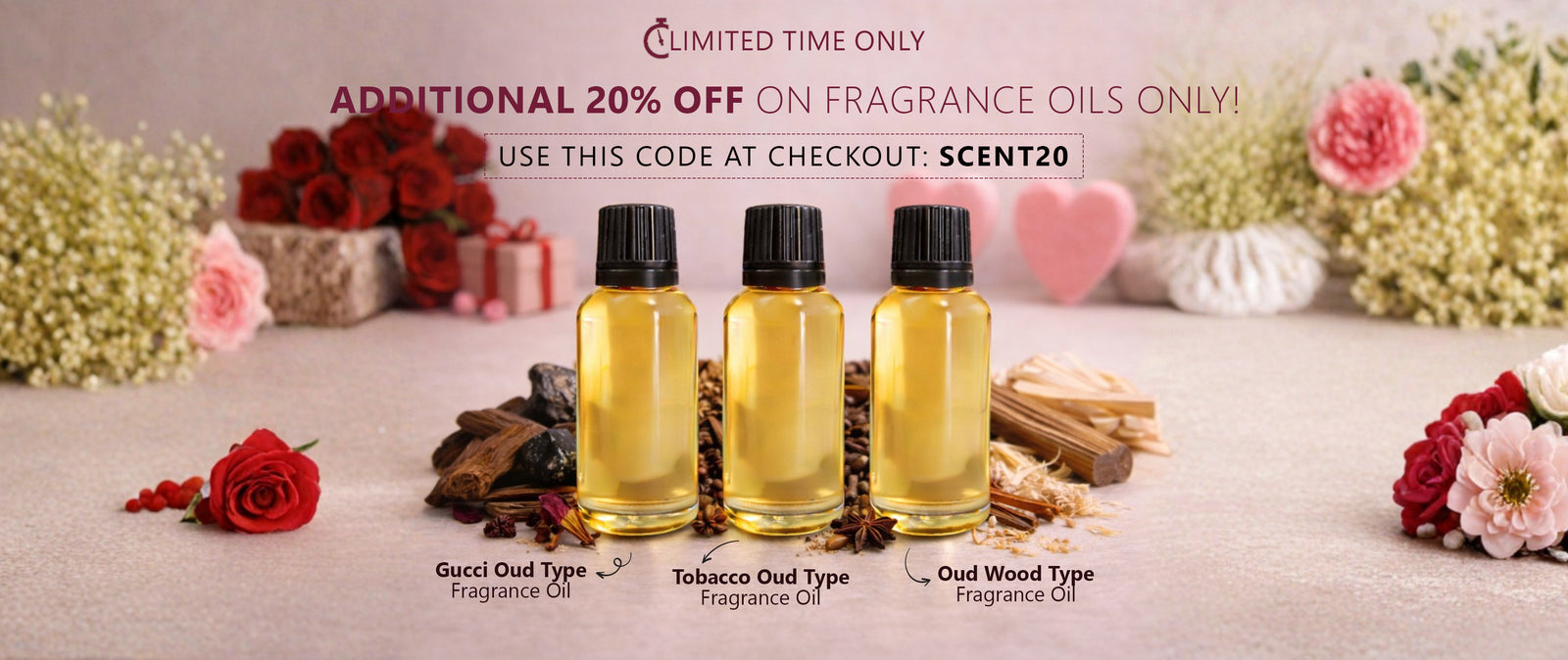 Three fragrance oil bottles on a decorative table with flowers and promotional text.